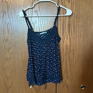 Maurices patterned spaghetti strap tank top with tie near the bottom. Size L